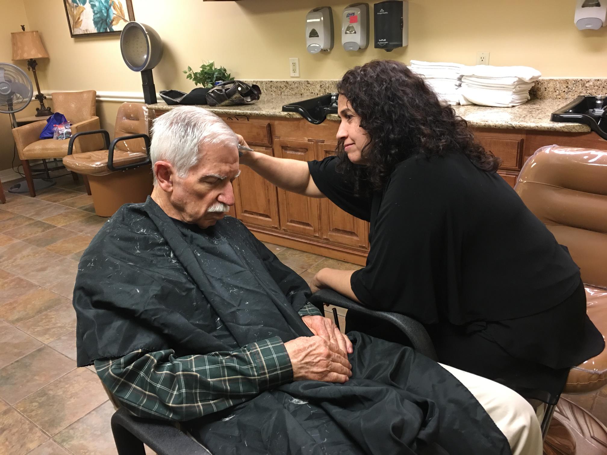 Daughter Melissa cut Gene's hair his last year at Silverado. He often cooperated by sleeping.