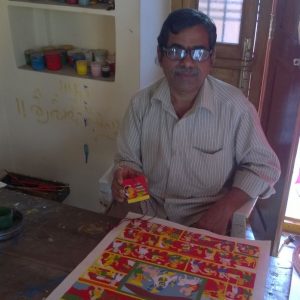 Mr Vykuntam with the medal and other Cheriyal paintings