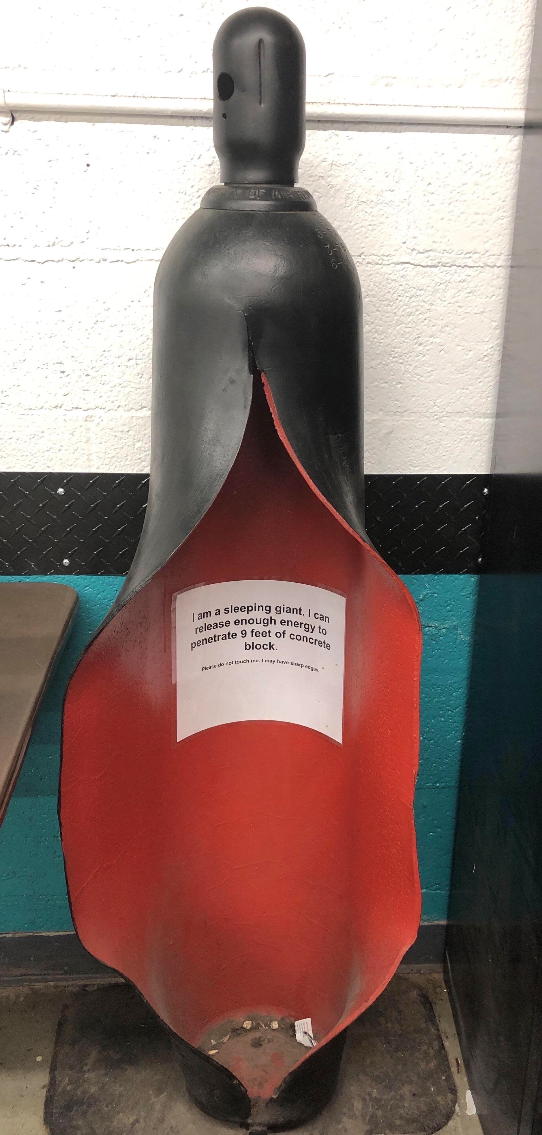 Ruptured gas cylinder safety warning photo