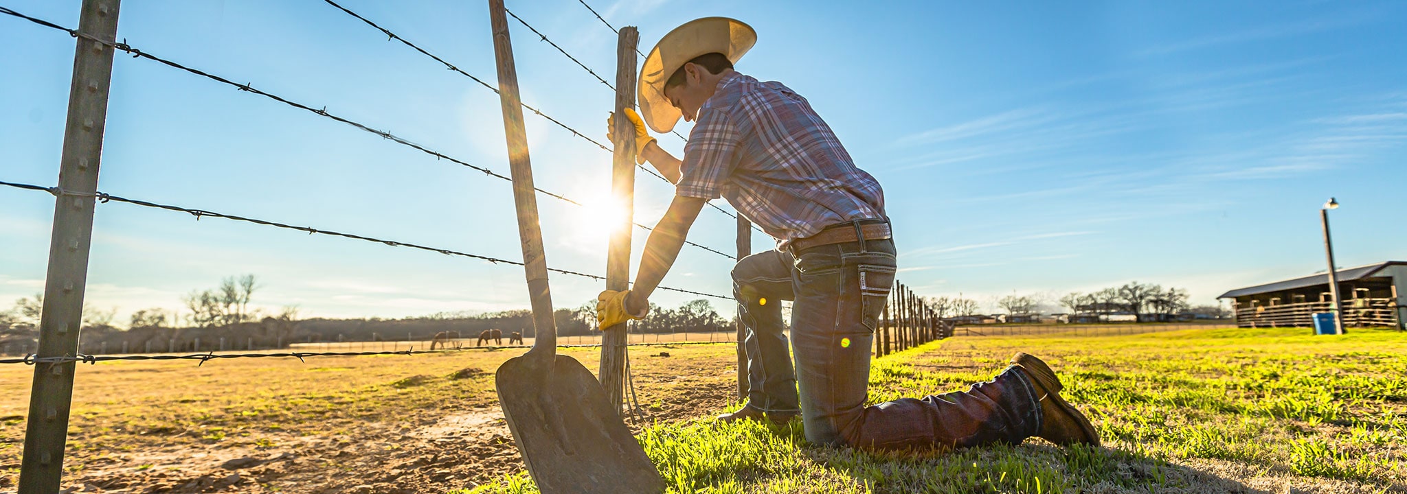 Rancher fixing a fence.