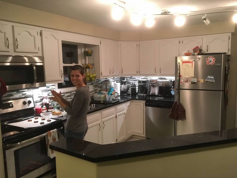 Michelle cooking gingersnap cookies at night