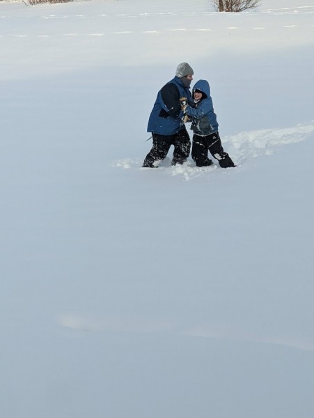 Mommy and Alex wrestling in snow and sledding too!