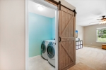 Barn Door to Laundry with Built in Shelving
