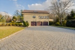 3 Car Garage with Paver Driveway
