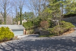 Serpentine drive with beautiful stone walls