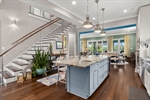 Kitchen opens to Dining and Great Rooms
