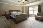 Master suite with a tray ceiling