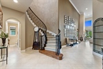 Expansive  elegant foyer provides views of lake