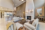 Floor-to-ceiling stucco fireplace as focal point