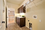 Main Level Laundry with sink  built-in cabinets