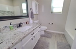 Bath 2 updated - granite tile floor tubtile