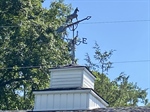 Cupala on roof with horse themed weathervane