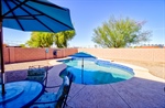 Inviting saltwater pool and extended patio