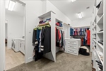 Closet with built-ins including hidden hamper