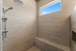 Oversize fully-tiled shower with dual heads