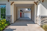 Long driveway leads to porte cochere