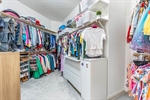 Huge walk-in closet with built ins