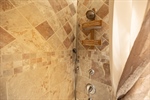 Tiled Shower with Two Jetted Shower Heads and Tub