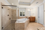 Vanities have granite tops and undermount sinks