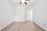 All bedrooms feature lighted ceiling fans.