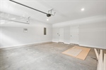 The garage has laundry room and storage access.