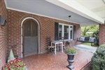 Fabulous arched front door and covered porch