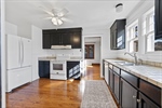 Eat-in kitchen with restored original floors