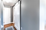 1st flr hall + sliding barn door to BD