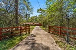 Winding drive takes you into the private acreage