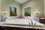 Take in the wooded views from the tub