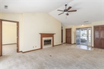Vaulted living room looking into bedroom #3
