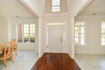 Entry Foyer featuring hardwood  lots of sunlight