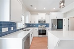 Full tile backsplash and pantry.