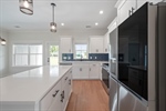 Stainless steel appliances including the fridge.