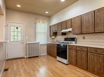 Back Door Off Kitchen Opens To A Spacious Deck