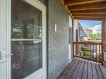 Covered Back Deck Walks Out From Kitchen