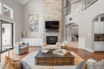 Floor to ceiling stone fireplace with gas logs
