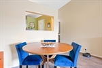 Dining room with vaulted ceiling.