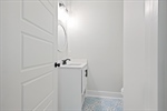 Main level powder room for your guests.