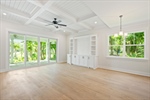 Great room with coffered ceiling and built ins.