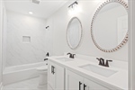 Second full bath with a shower over tub.