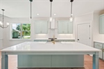 Gleaming counters and full tile backsplash.