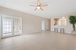 Spacious great room with tile flooring.
