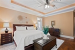 Tray ceiling and lighted ceiling fan.
