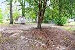 The storage shed remains with the home.