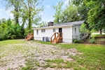 Large and partially fenced backyard.