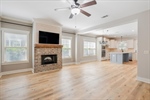 Great room opens to dining and kitchen areas.