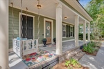 Be greeted by an expansive covered front porch.