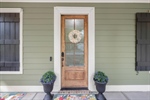 Enter through a beautiful front door.