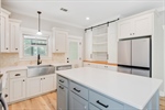 Stainless appliances including the refrigerator.